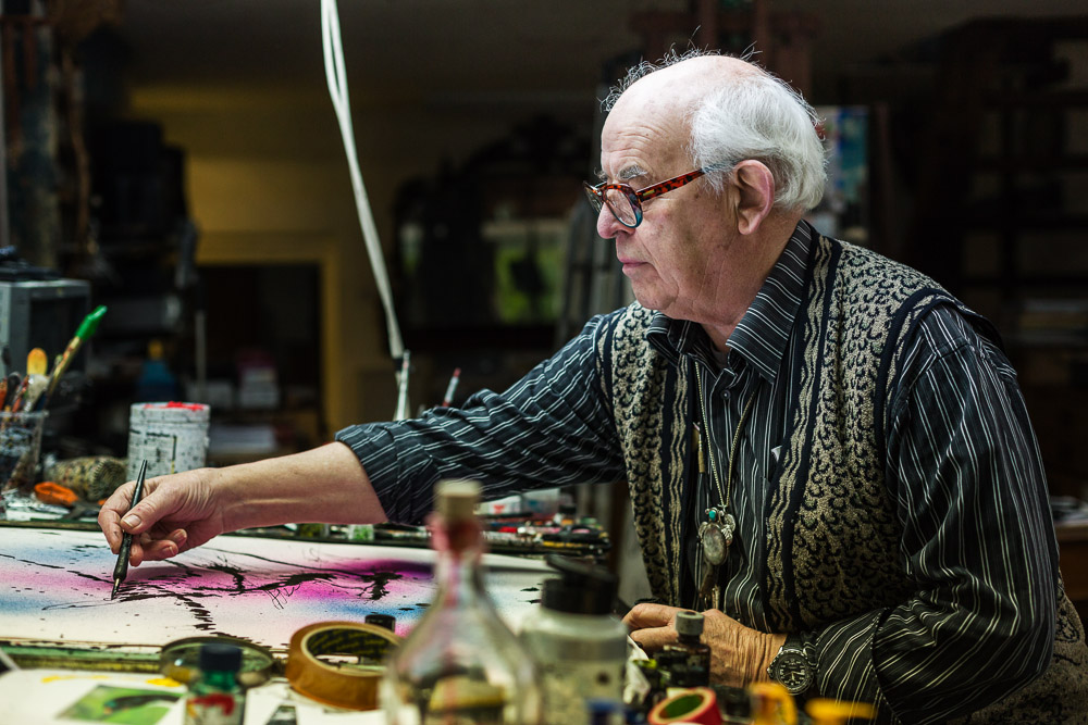 A portrait of Ralph Steadman by Rikard Osterlund, drawing in his studio in Kent